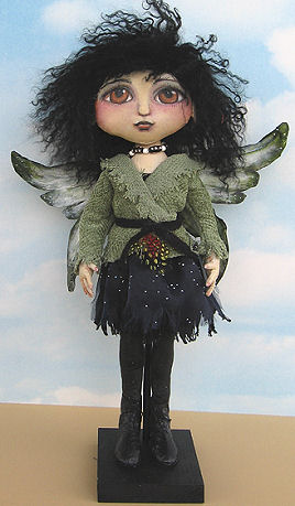 Tyvek wings and boots adorn this very cool 16” painted fairy.