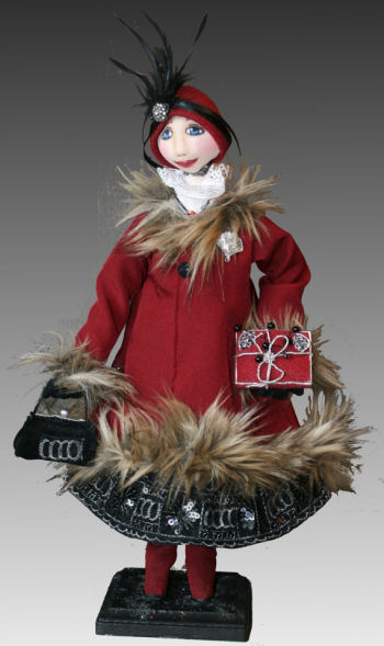Miss Maggie is 18" tall made of cloth with an innovative slipcover on her face.