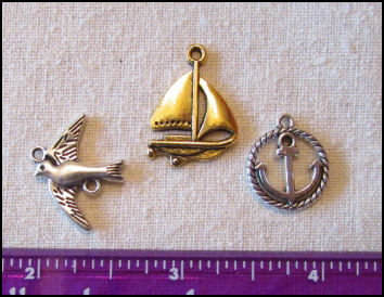 Steampunk Trinkets - Nautical Theme for Art Dolls - Gold sailboat, silver rope circle sailboat, and silver bird/seagull